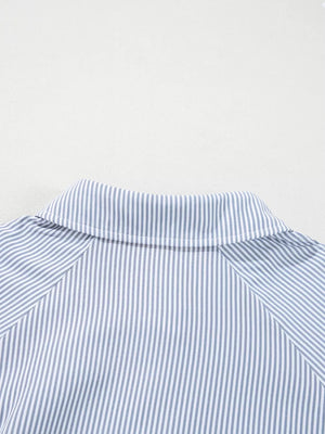 Striped button-up shirt with a pointed collar and long sleeves.