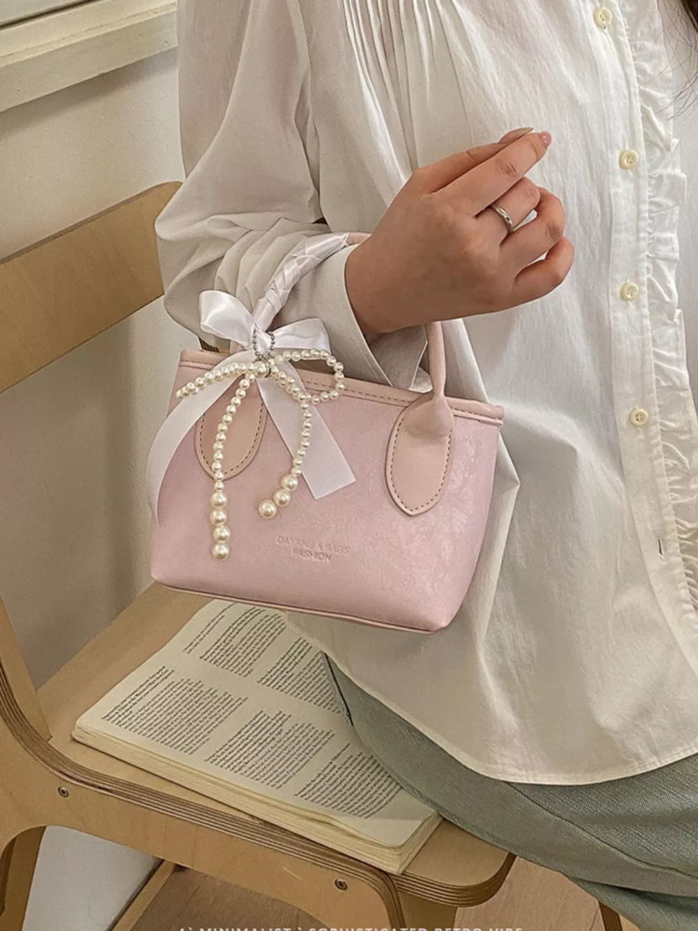 Pearl Bow Charm Crossbody Bag in Blush Pink