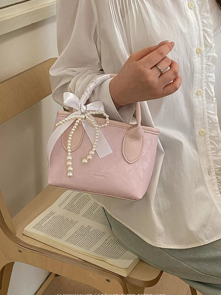 Pearl Bow Charm Crossbody Bag in Blush Pink