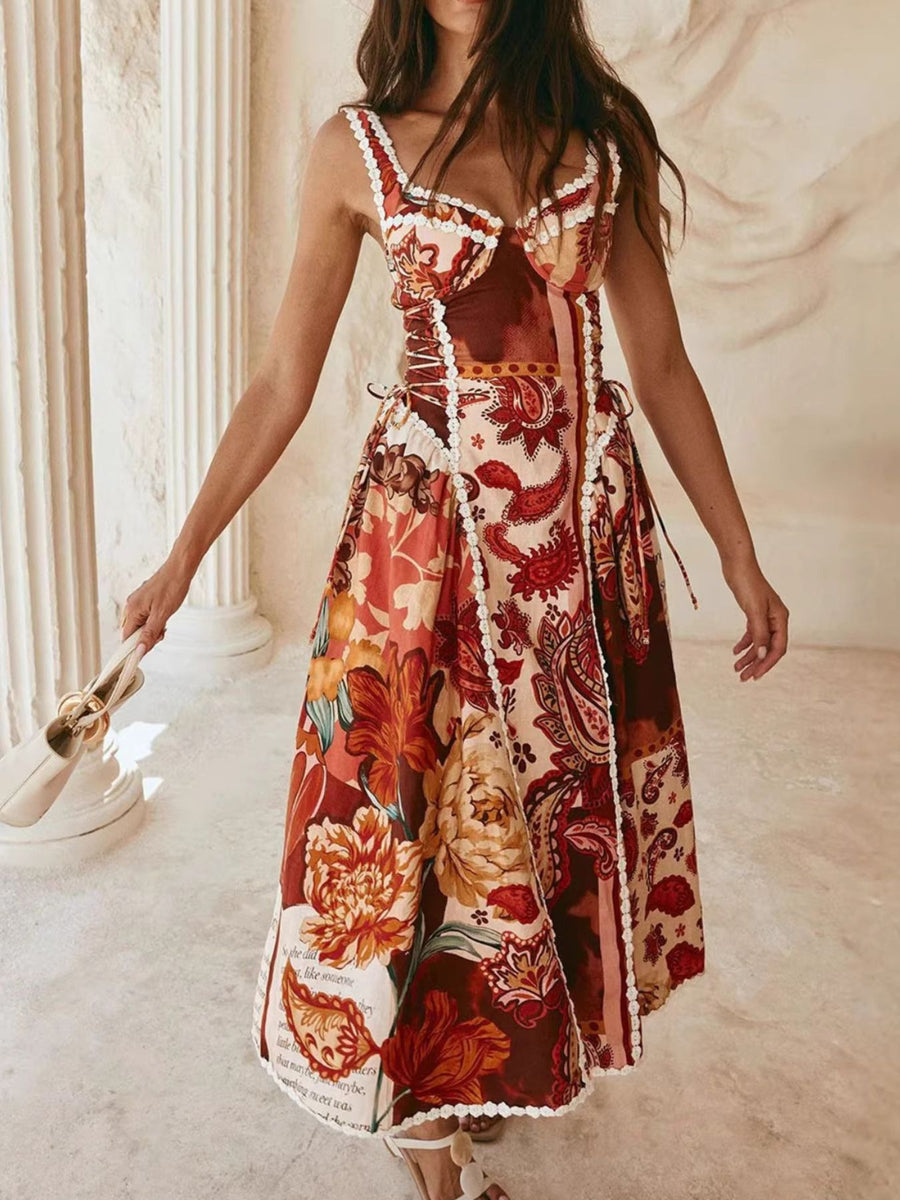 Midi dress with paisley floral print, lace trim, sweetheart neckline, and tie sides.