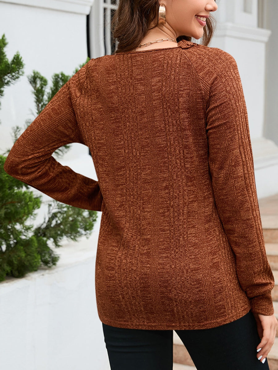 Textured knit top in chestnut with raglan sleeves and a crew neck.