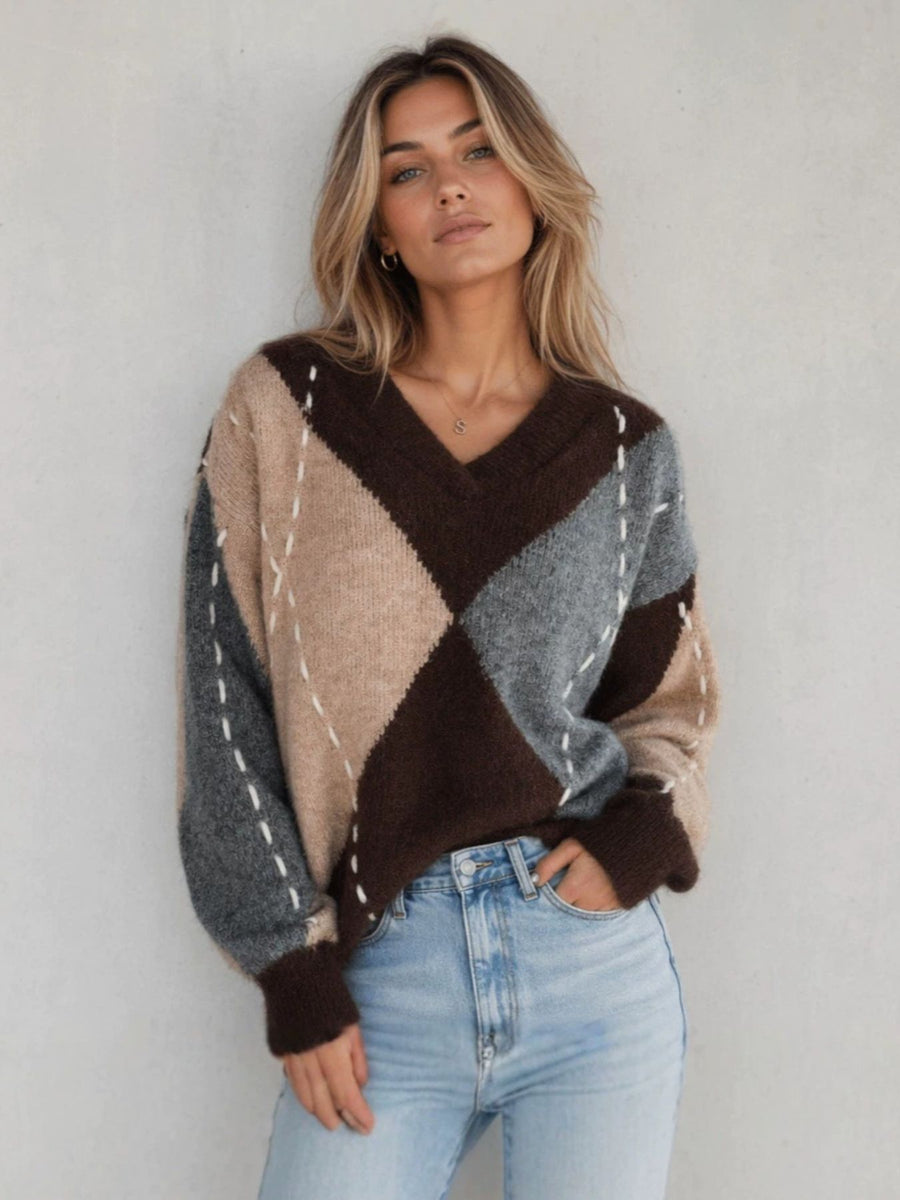 100% polyester Care instructions: Machine wash cold v-neck sweater in slate gray with oversized silhouette