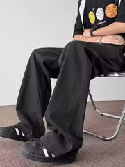 Men's black casual wide-leg cargo pants with multiple pockets and a relaxed fit.