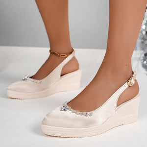 Satin slingback espadrille wedges in light gray with crystal embellishments and ankle strap.