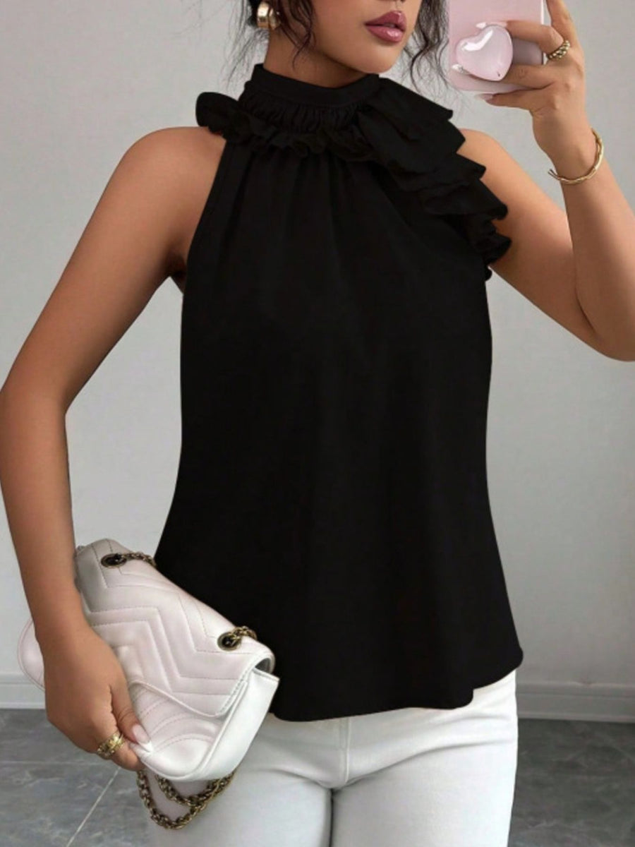 Black ruffled high neck sleeveless blouse with tiered ruffle detail on shoulder.