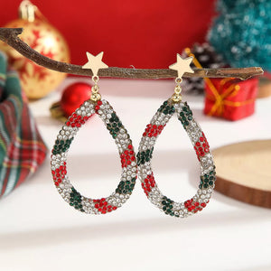 earrings in red featuring rhinestone embellishment and teardrop fit