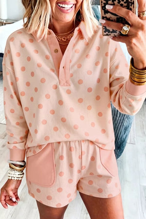Pink polka dot lounge set with collared long sleeve top and shorts with pockets.
