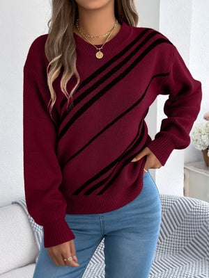 Red striped casual sweater with round neck and acrylic blend material.