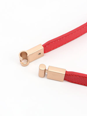 Red elasticated belt with gold buckle detail and leather trim