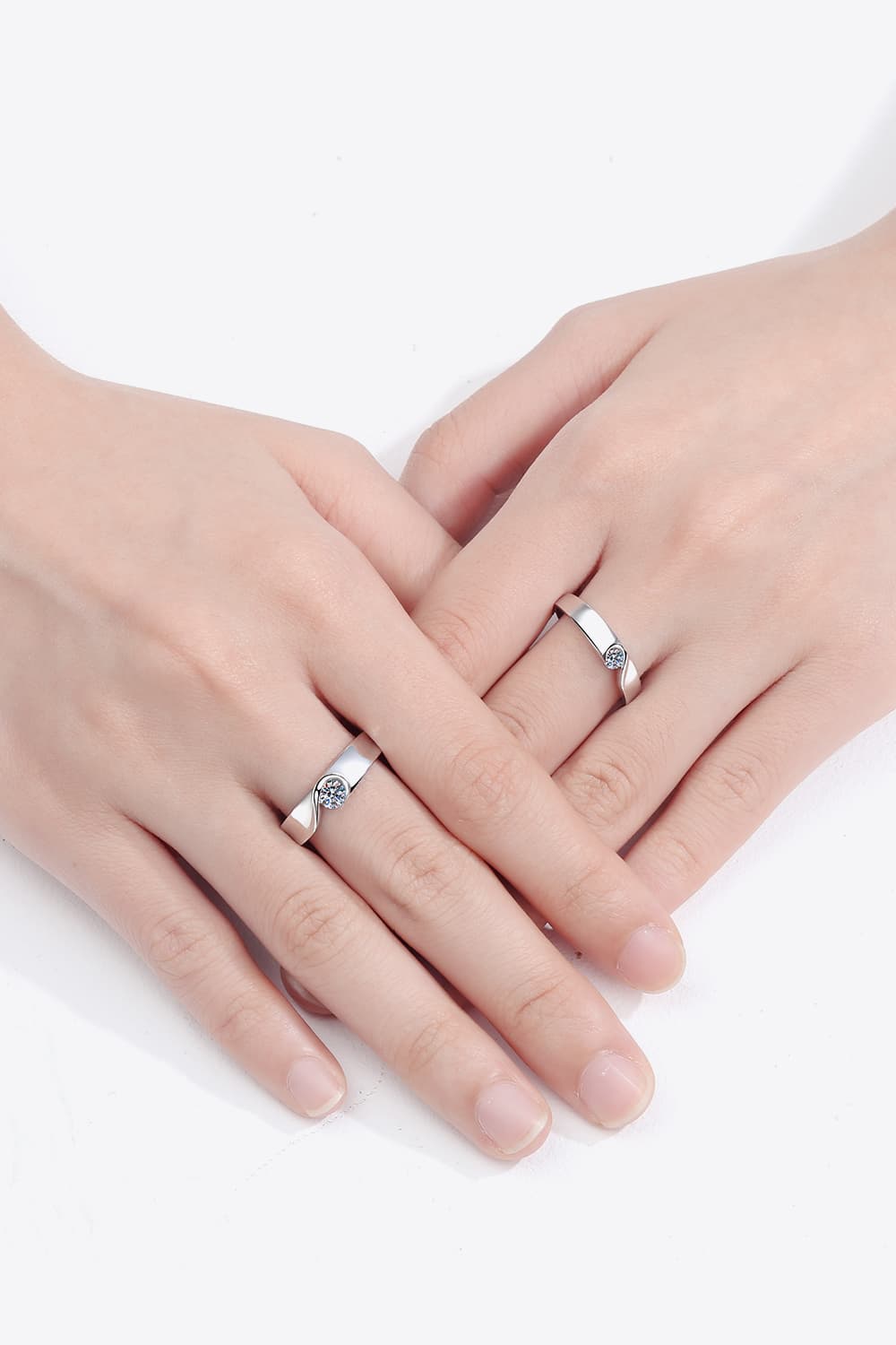 Curved Embrace diamond ring set for men and women, silver band with a single stone.