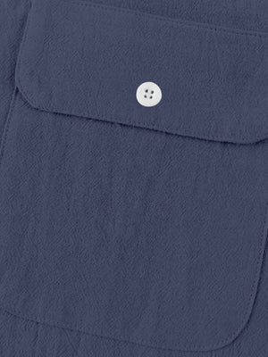 Navy blue cotton short-sleeve shirt with band collar and button-down pocket detail.