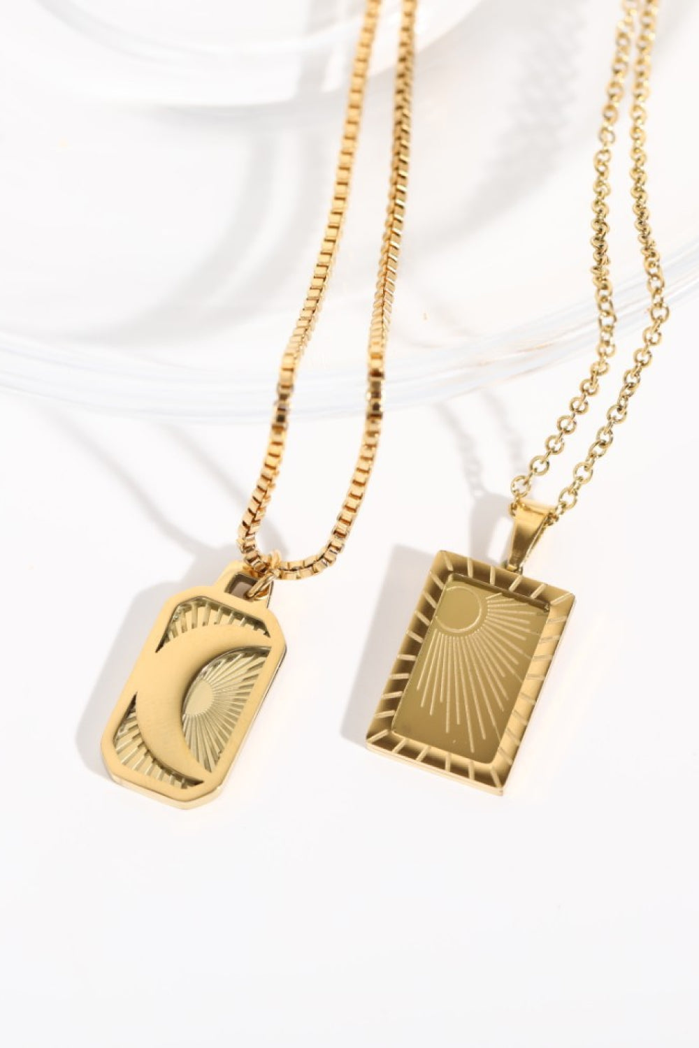 18K gold-plated necklaces with celestial sun and moon charms.