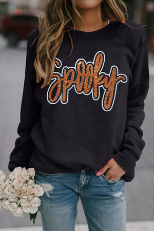 50% polyester, 50% cotton Care instructions: Machine wash cold sweatshirt in Black with relaxed silhouette