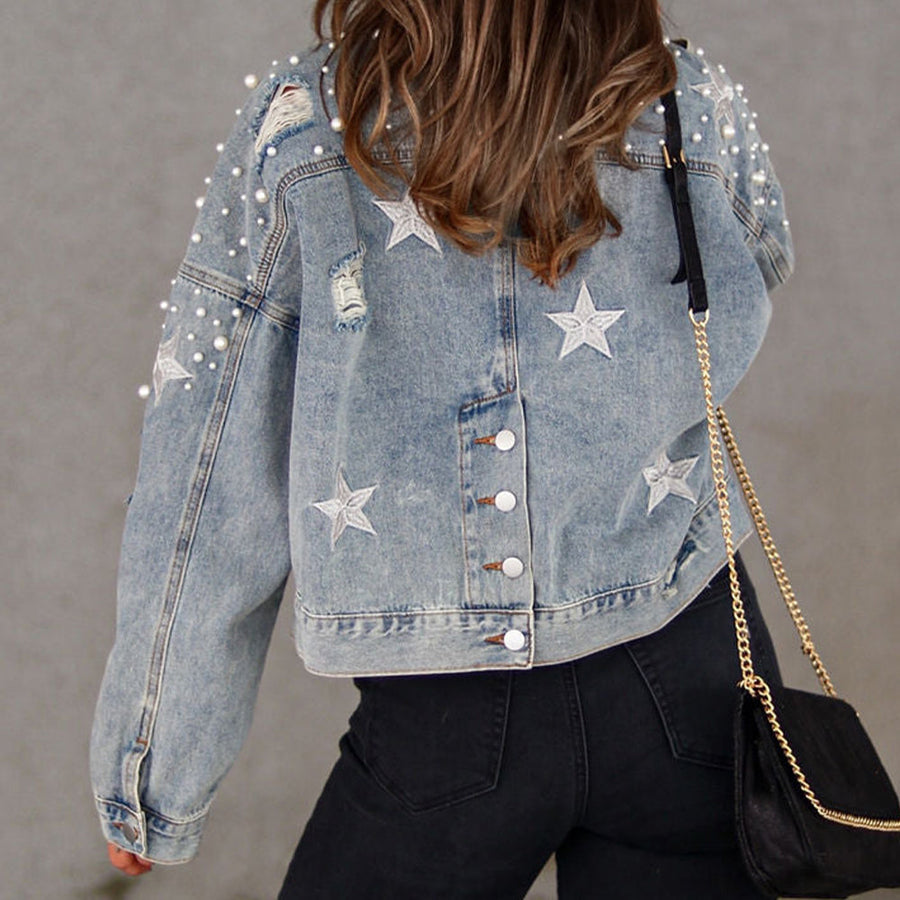 Light denim jacket with pearl embellishments and star patches, distressed details.