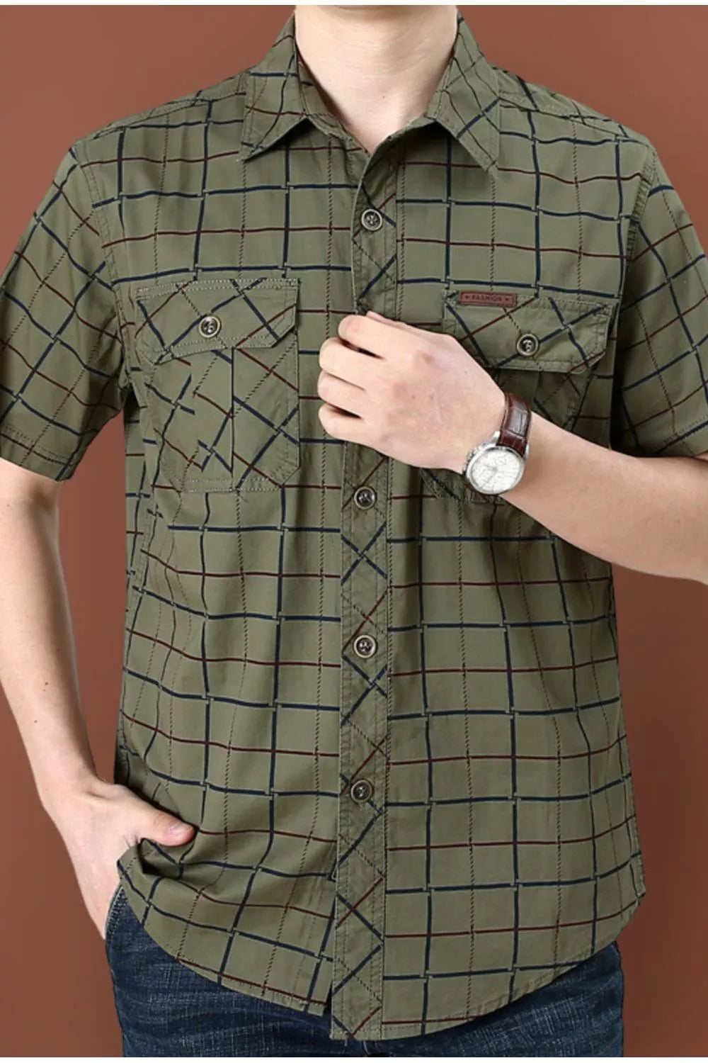 Men's short sleeve button-down shirt in Army Green plaid cotton blend with two chest pockets.