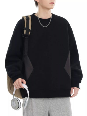 Black oversized cotton crew-neck sweatshirt with dark gray panel details.