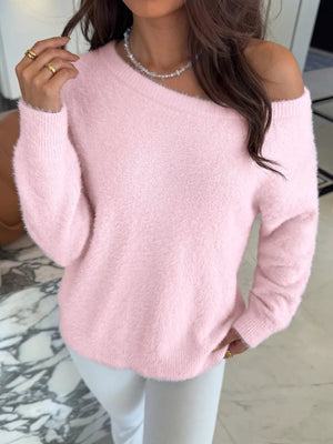 Pink fuzzy off-the-shoulder sweater with long sleeves and a relaxed fit.