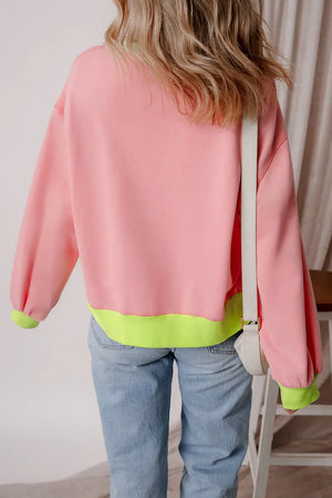 Blush pink cotton sweatshirt with neon green trim and cuffs.