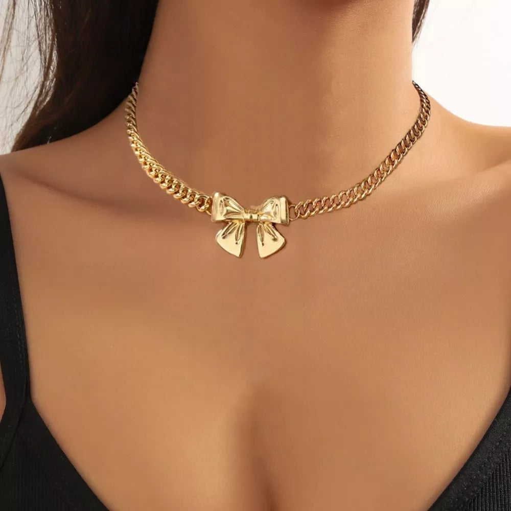 necklace in gold featuring bowknot charm and straight fit