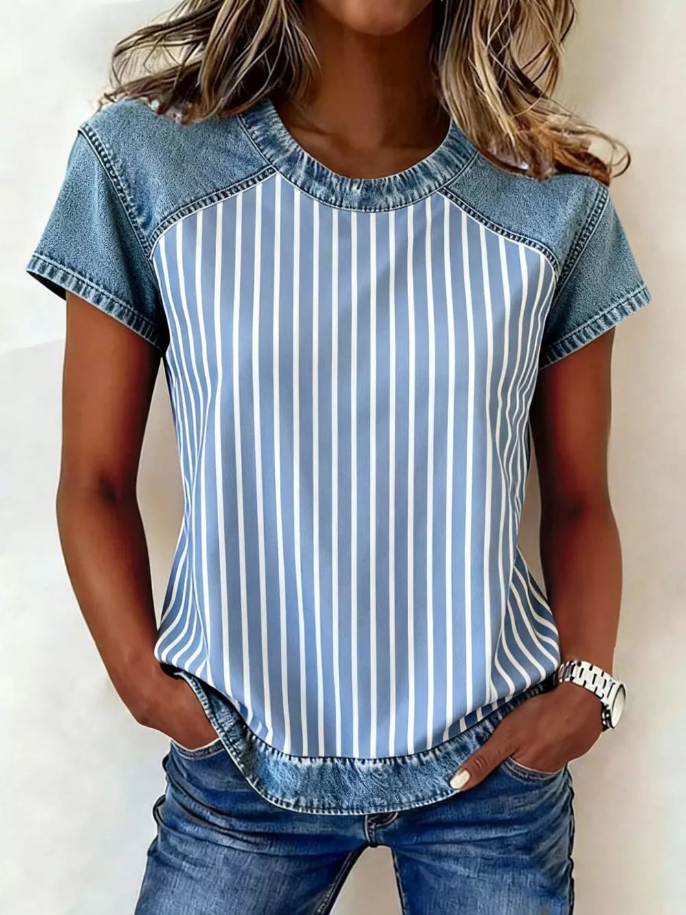 Denim patchwork short sleeve shirt with blue and white vertical stripes and distressed denim details.