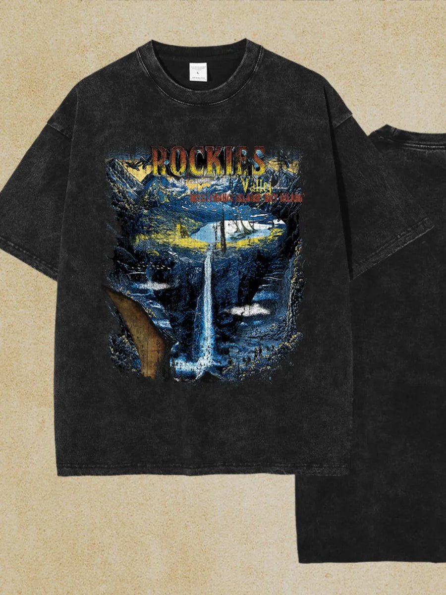Black vintage wash graphic tee with Rockies waterfall scene and text.