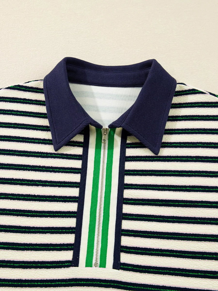 Zippered contrast collar striped top in navy with white and green stripes.
