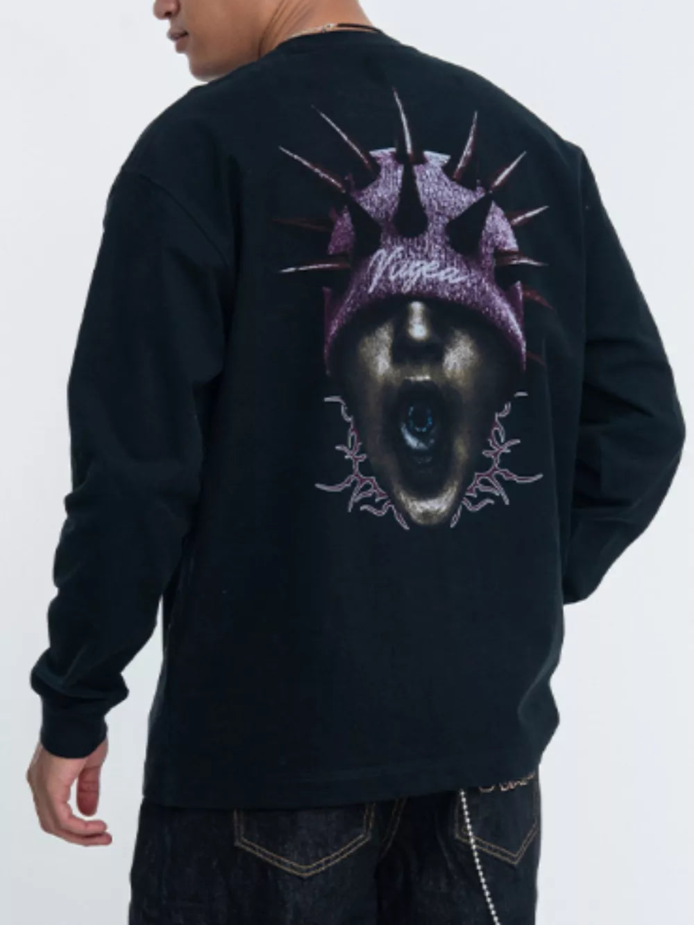 Black long sleeve t-shirt with graphic print of a screaming face wearing a spiked beanie.