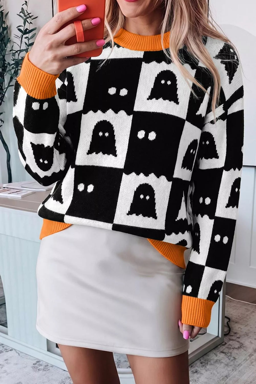 orange pullover sweater with ribbed hem and long sleeve
