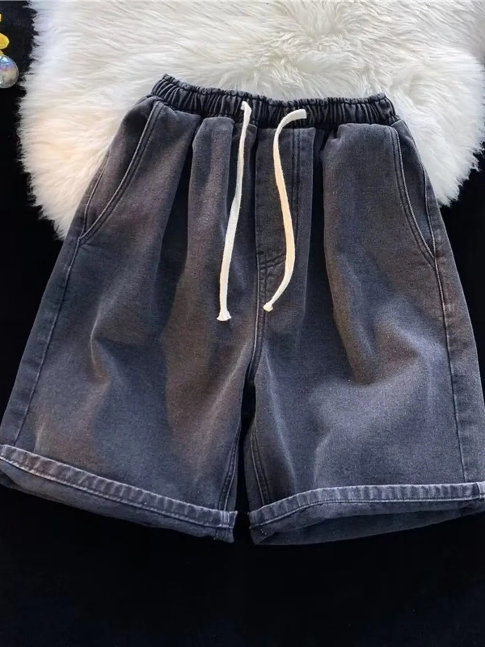 Men's relaxed fit black washed denim shorts with drawstring and cuffed hem