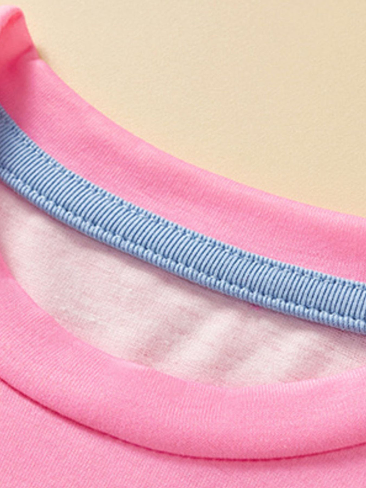 Pink toddler t-shirt with blue striped neckline detail