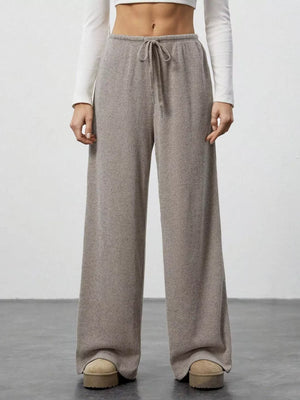 Relaxed wide-leg pants in mocha ribbed knit with drawstring waist.