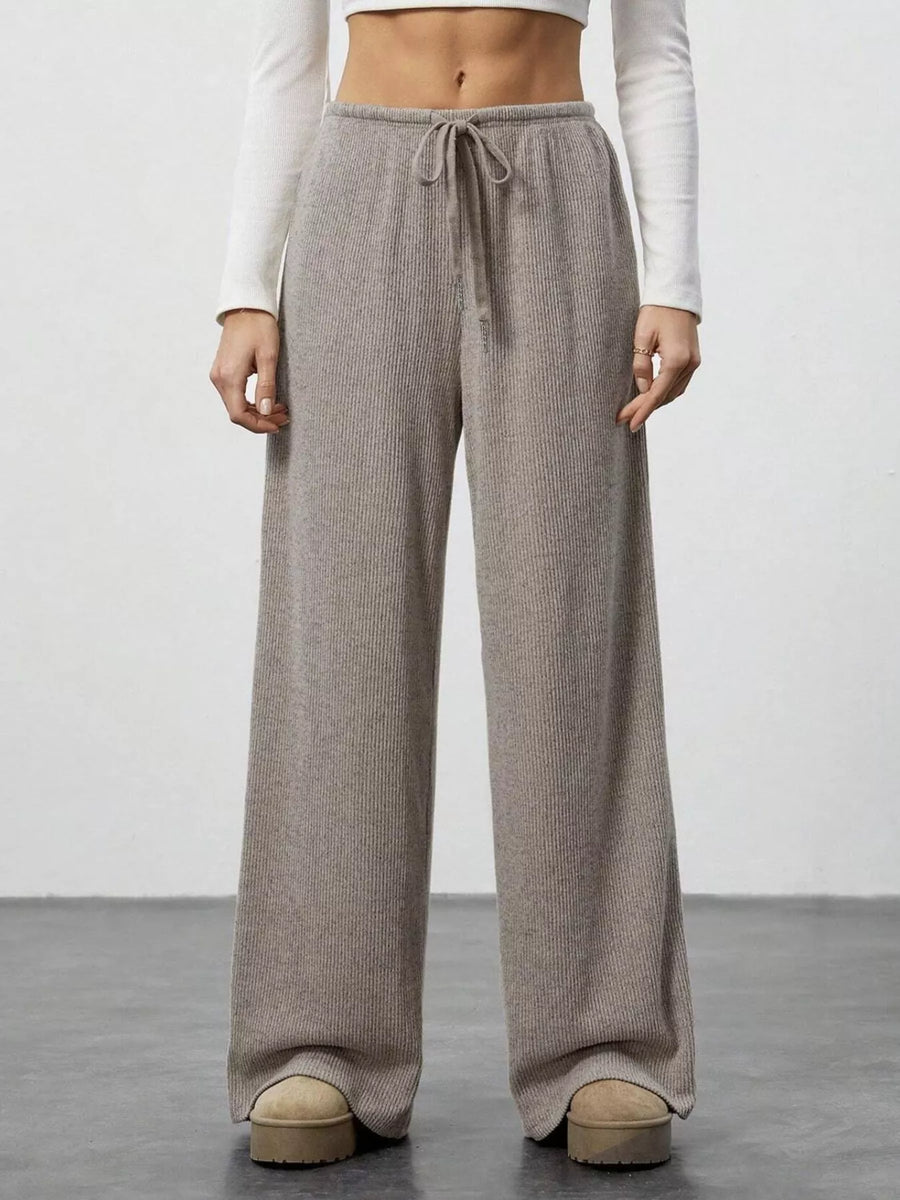 Relaxed wide-leg pants in mocha ribbed knit with drawstring waist.