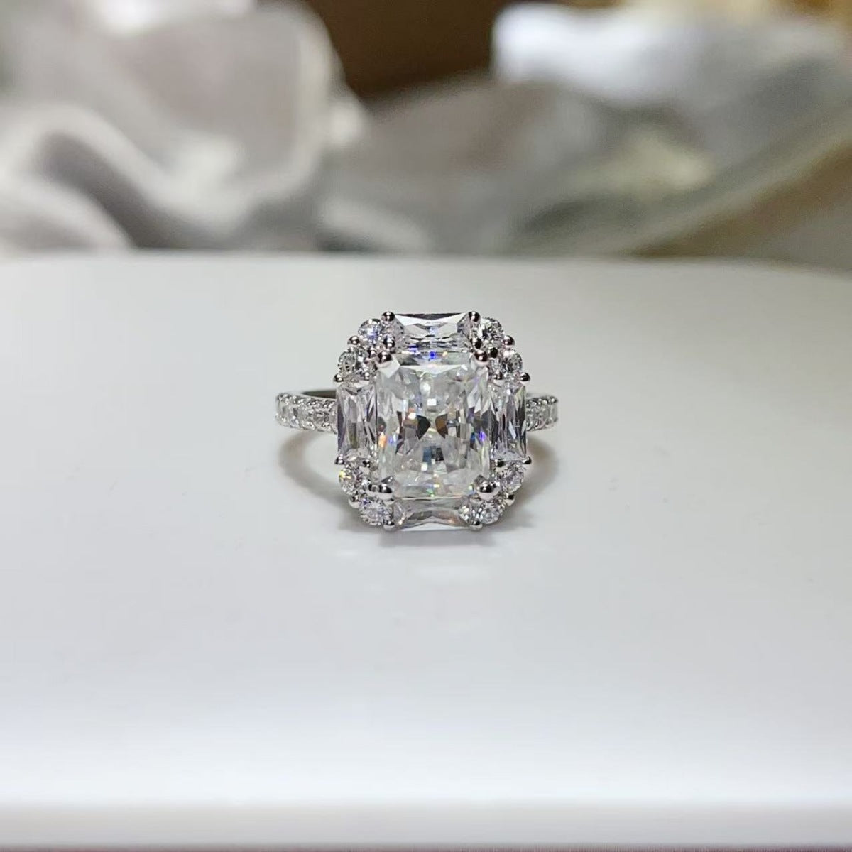 ring in silver featuring halo setting and classic fit