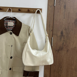 White pu leather crescent shoulder bag with adjustable strap