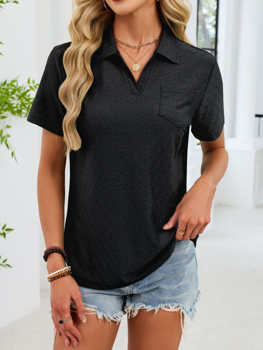 Black eyelet polo collar blouse with short sleeves and a chest pocket.