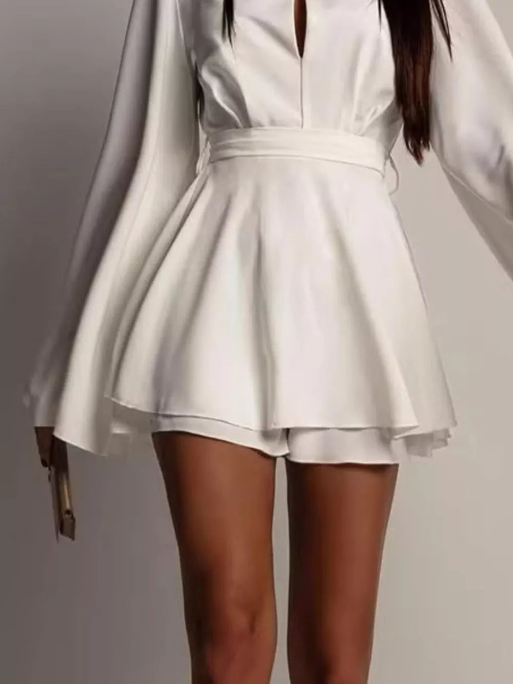 100% polyester Care instructions: Machine wash cold mini dress in Tan with fit-and-flare silhouette