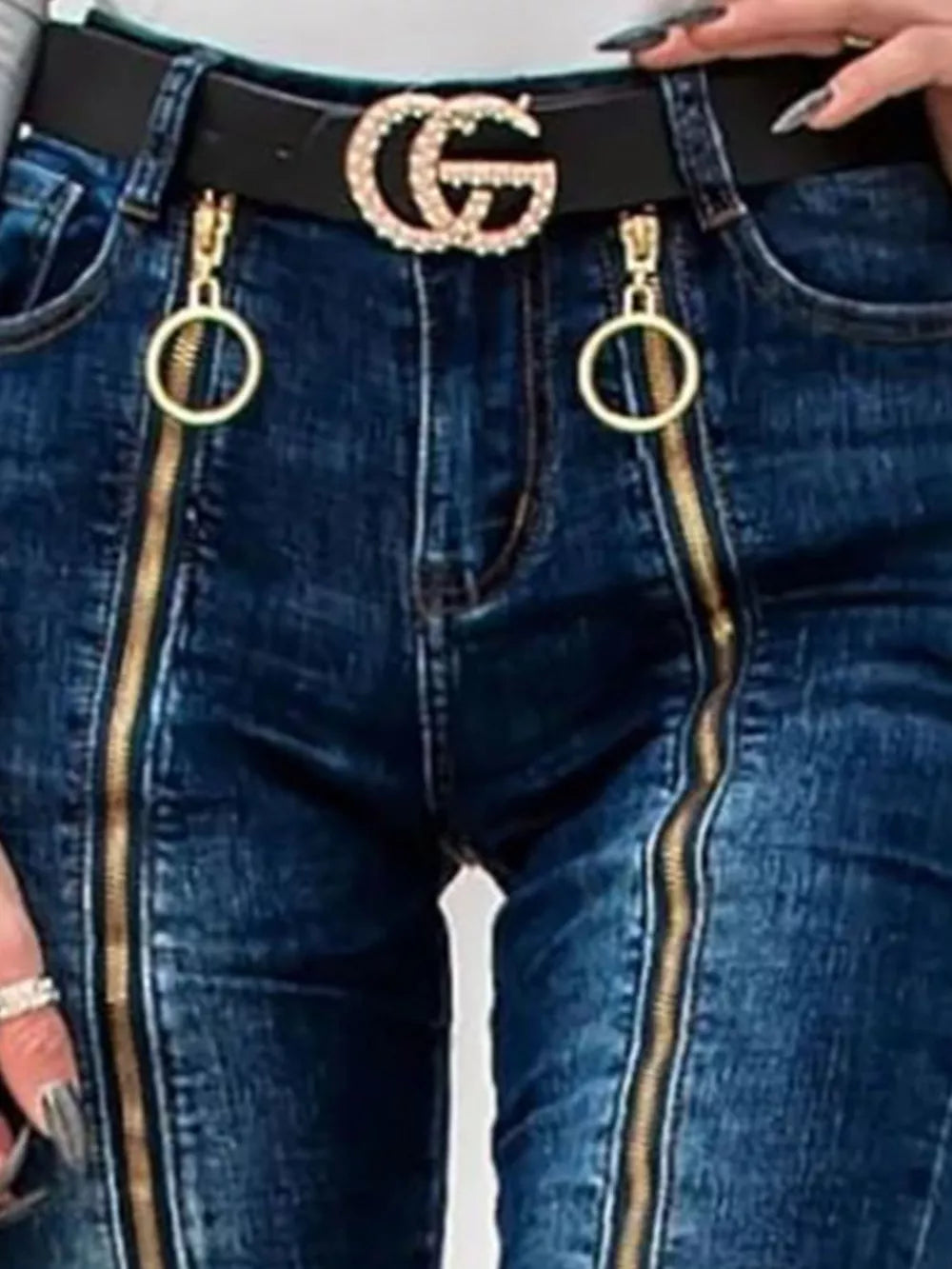 Dark blue skinny jeans with gold zipper details and ring pulls.