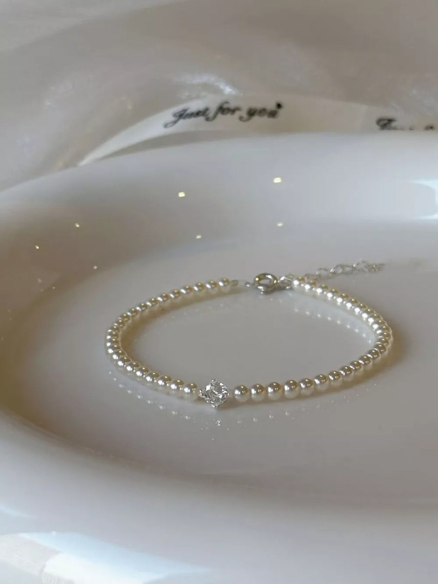 Synthetic Pearl,Alloy,Zircon Care instructions: Avoid wearing during exercise, a bracelet in White with fitted silhouette
