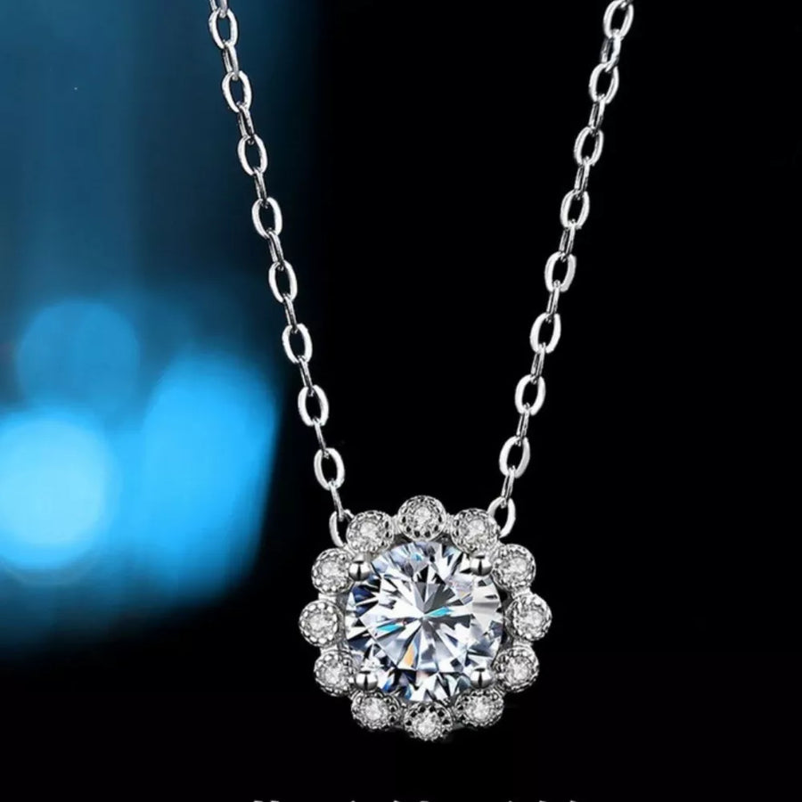 clear necklace featuring flower pendant and floral