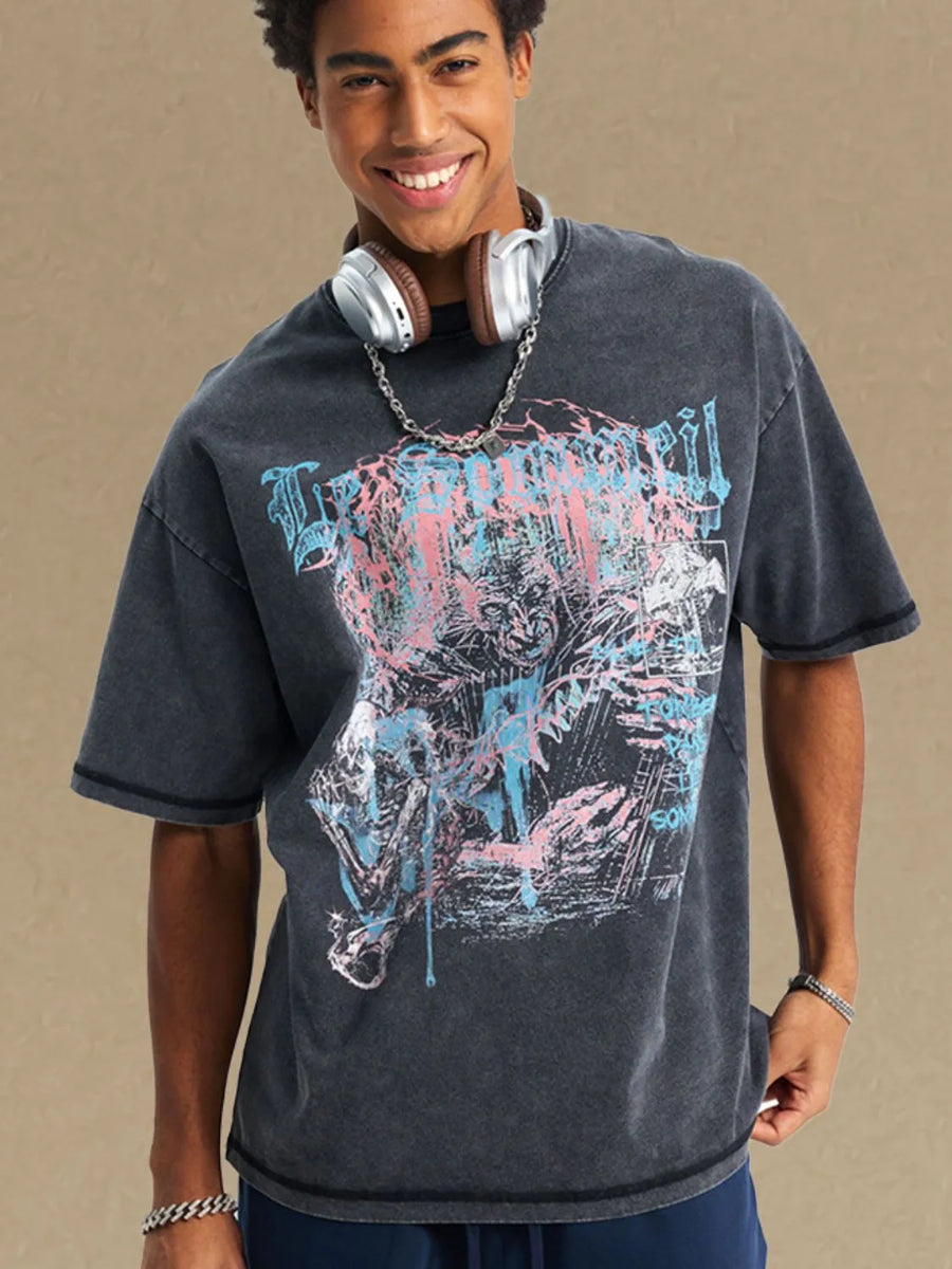 Black acid wash oversized graphic tee with distressed print and crew neck.