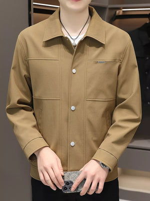 Men's caramel snap down jacket with textured fabric and chest pockets.