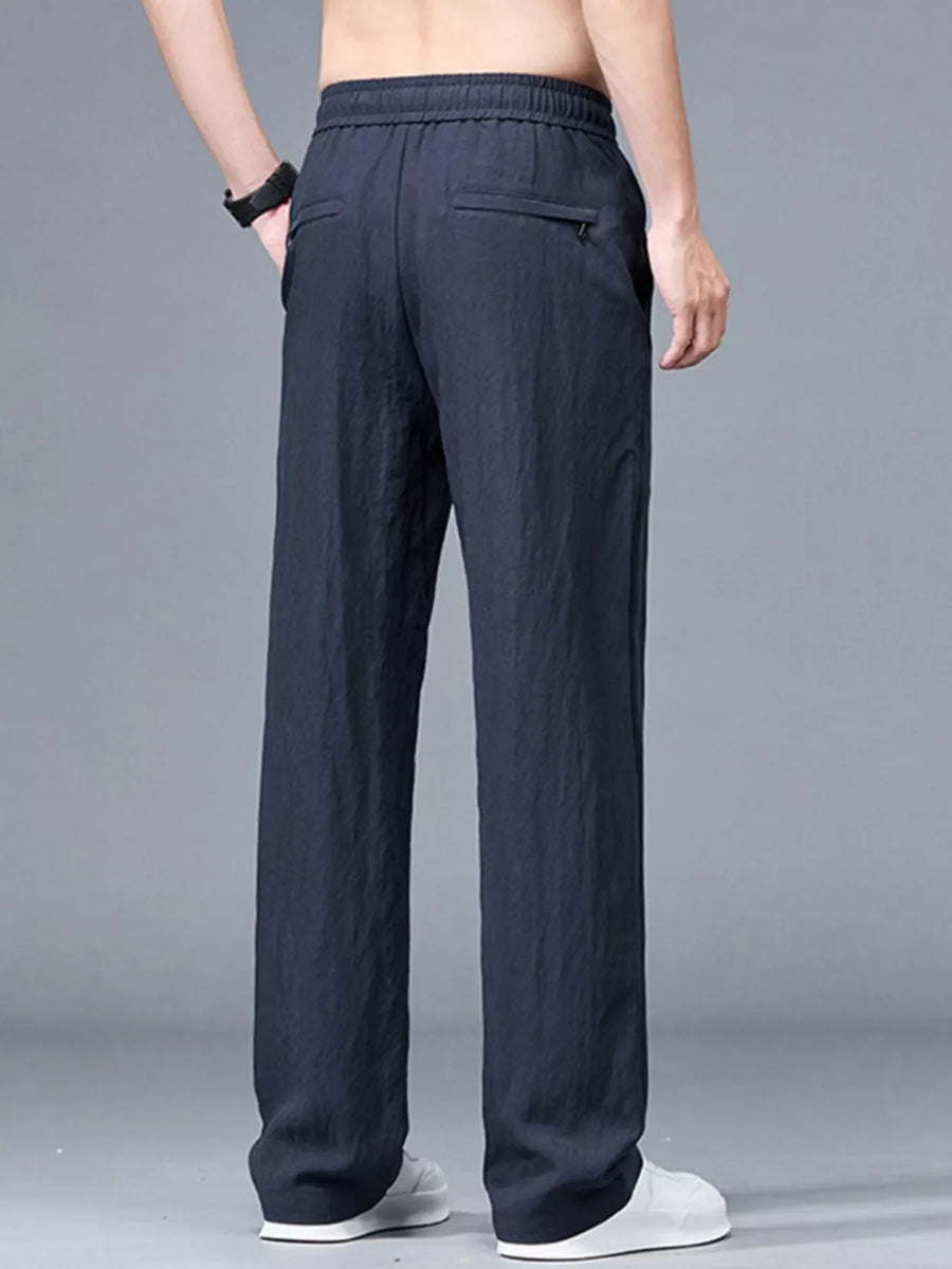 Navy blue casual trousers with drawstring waist and zippered back pocket