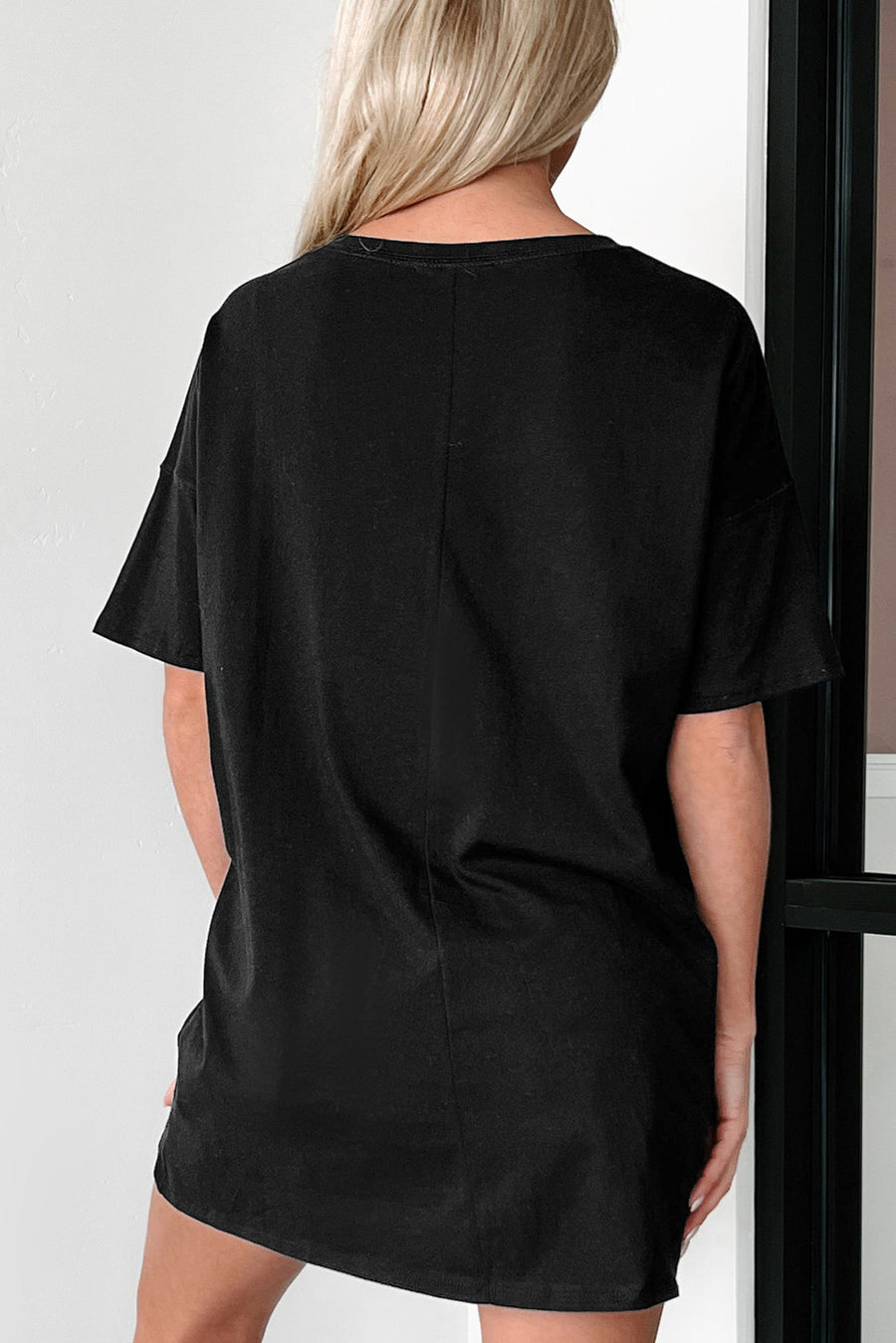 Black graphic t-shirt with short sleeves and a relaxed fit.