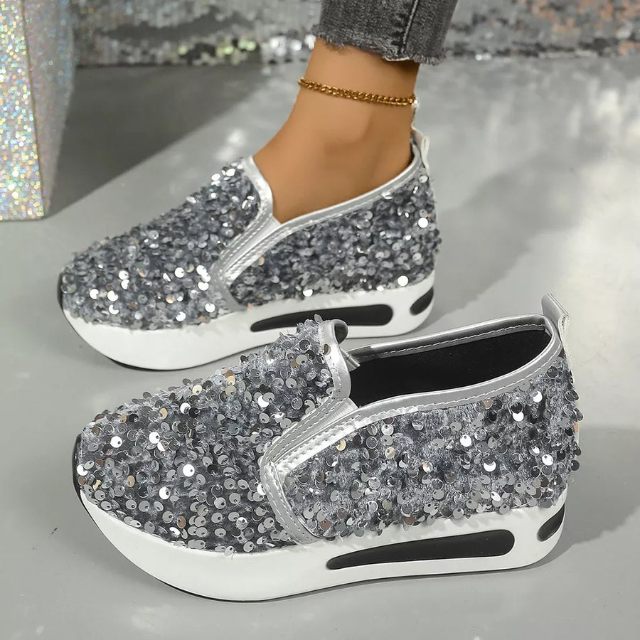 Glamorous grey sequin slip-on shoes with white platform soles.