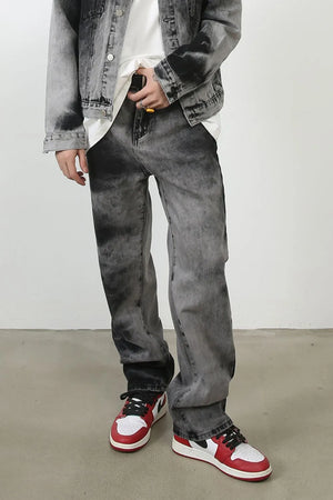 Charcoal wash straight leg denim jeans with a faded, marbled pattern.