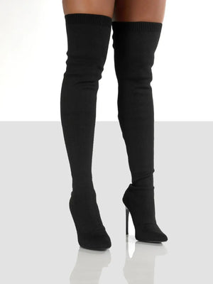 Black knit over-the-knee stiletto booties with a ribbed top cuff.
