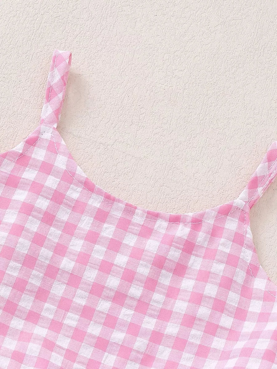 Pink gingham ruffled tank top with white straps.