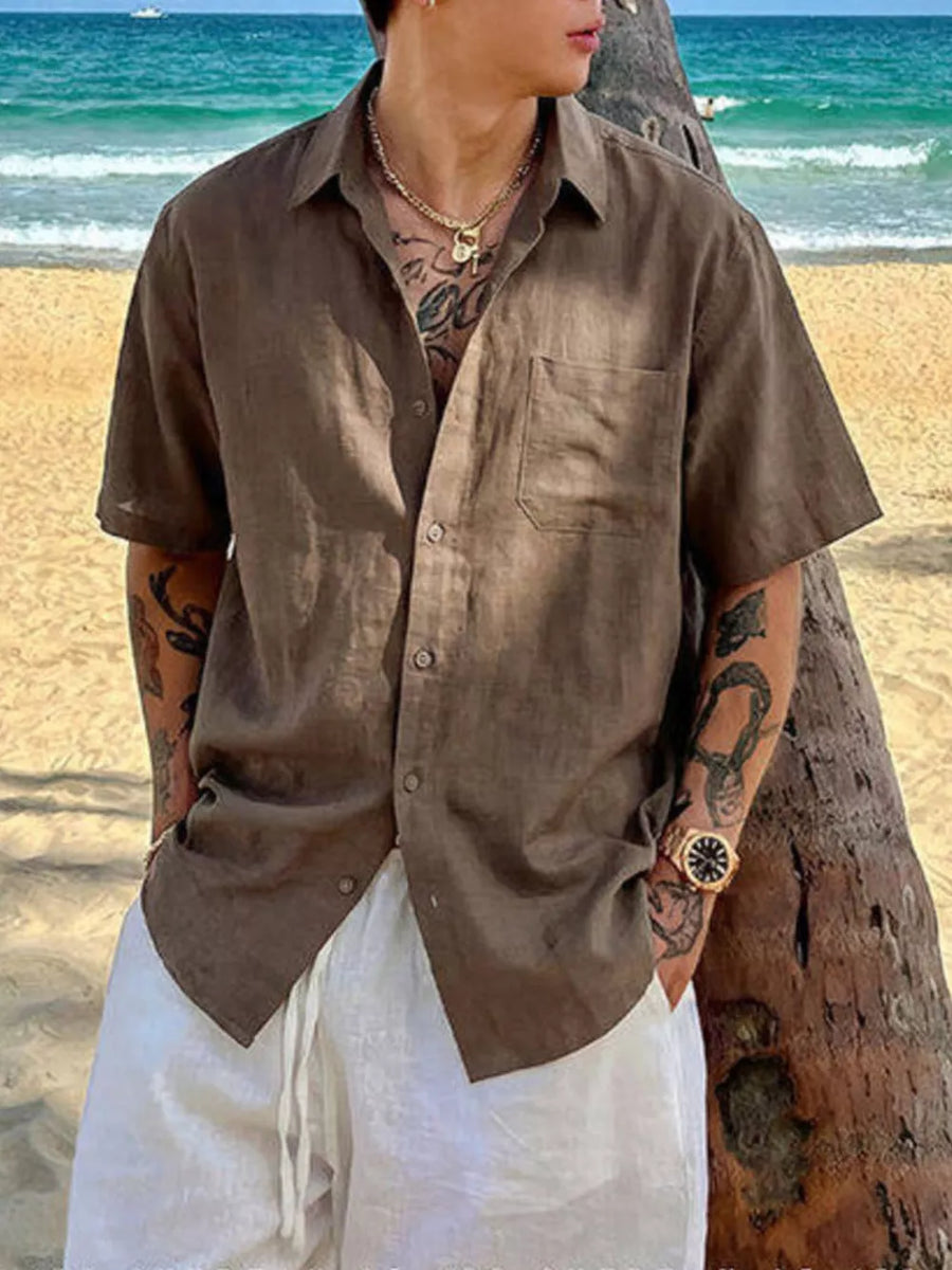 Brown relaxed fit buttoned casual shirt with short sleeves and a chest pocket.