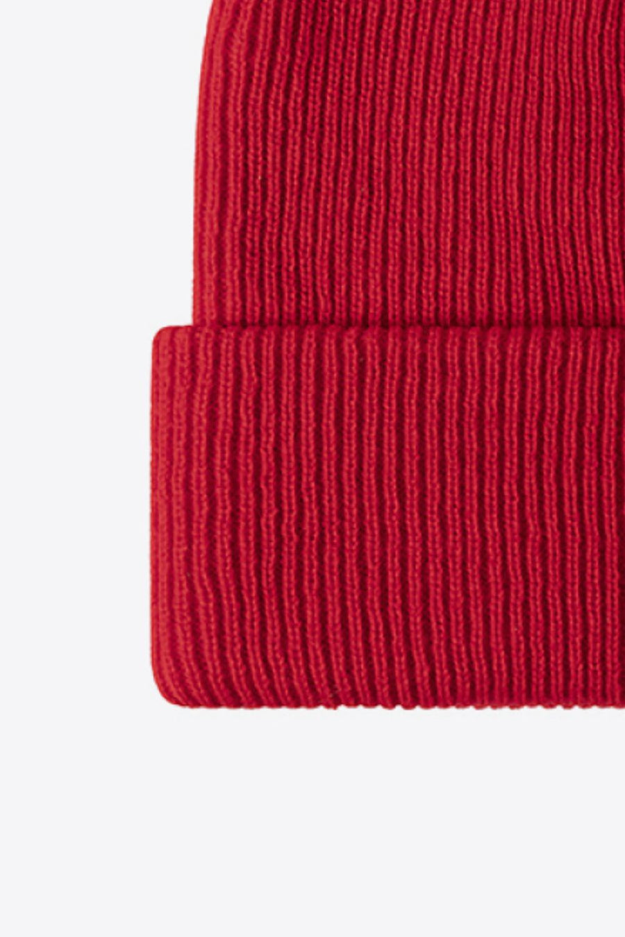 Red ribbed knit beanie with a folded cuff