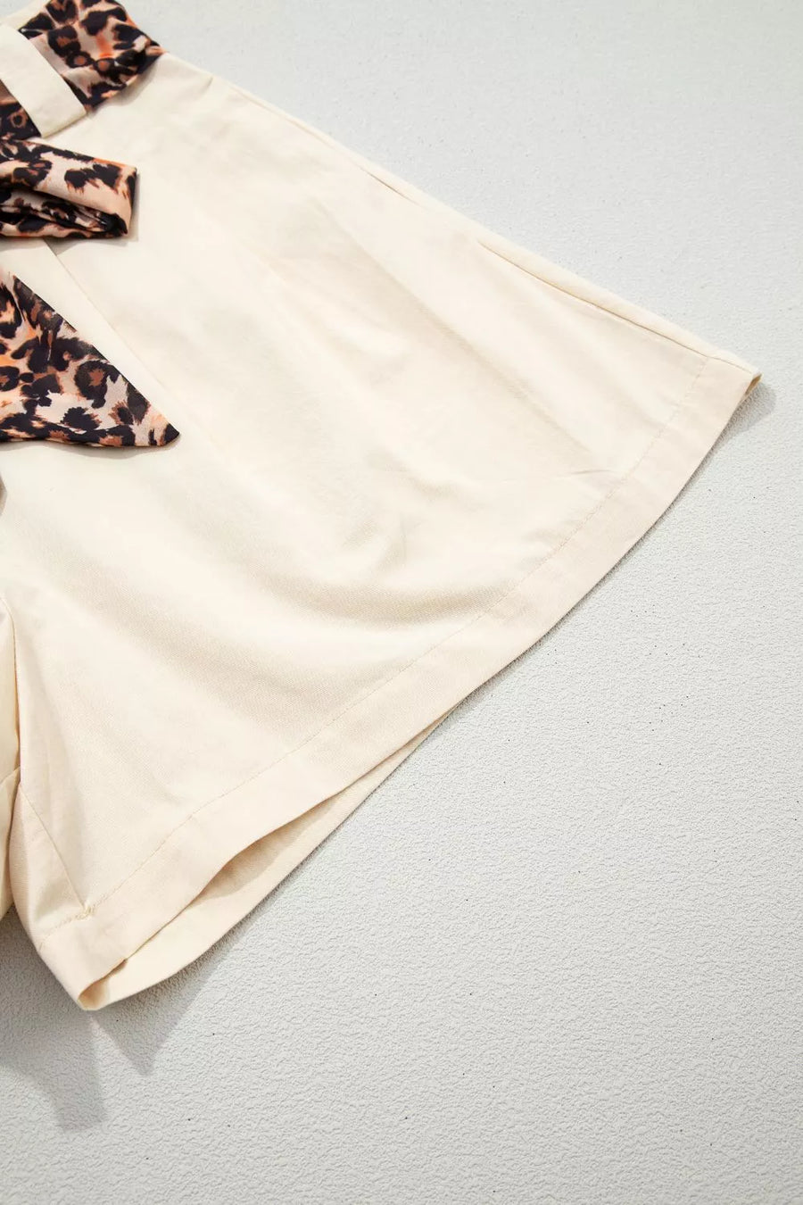 Cream shorts with leopard print bow detail